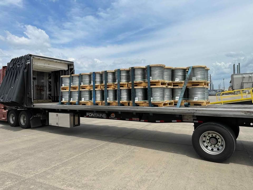 Open-deck cargo secured with straps